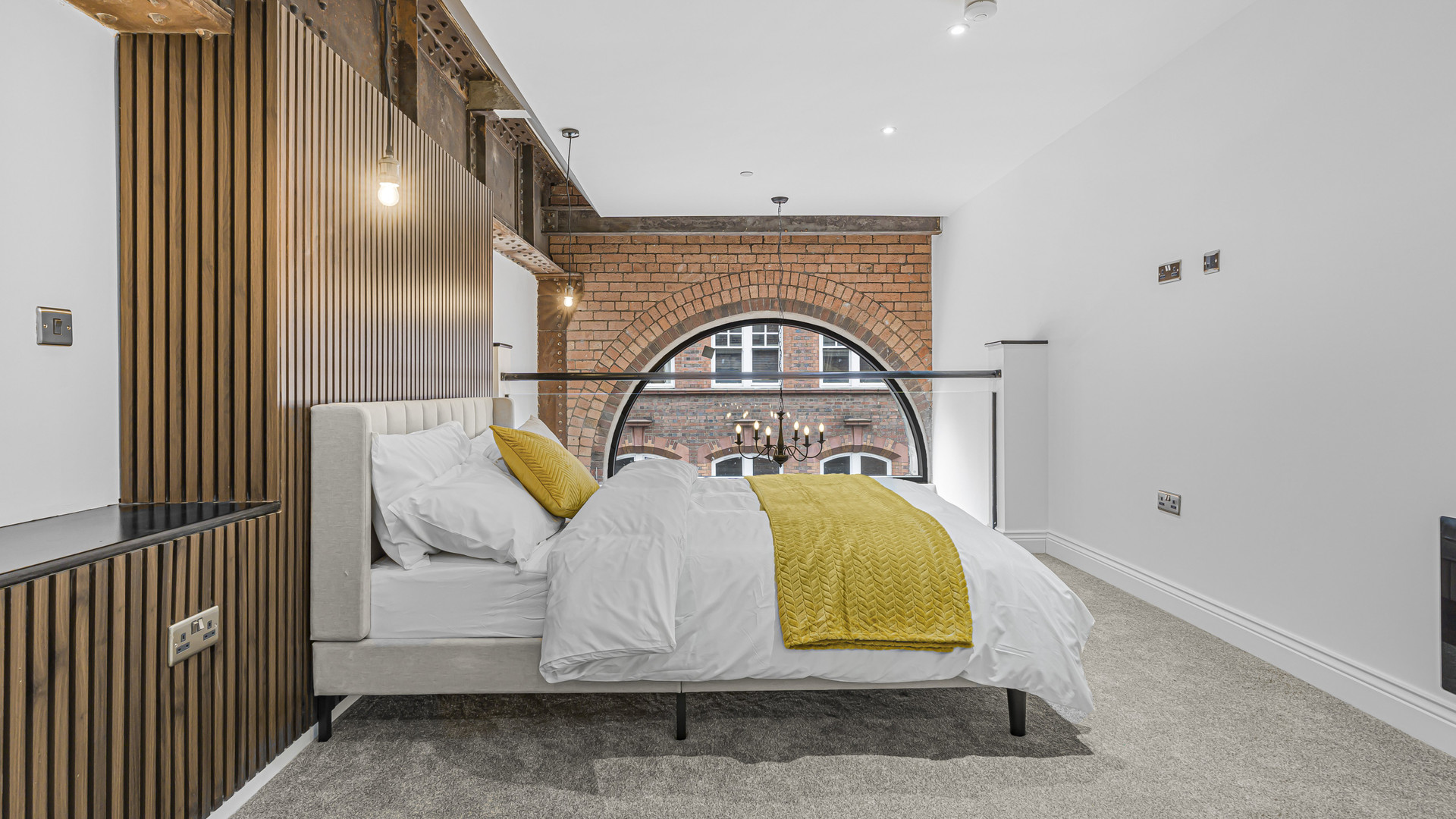 Bedroom with arched brick window
