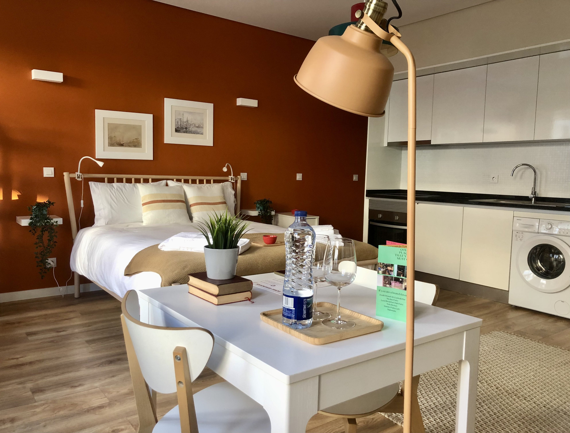 Studio overview with bed and kitchen