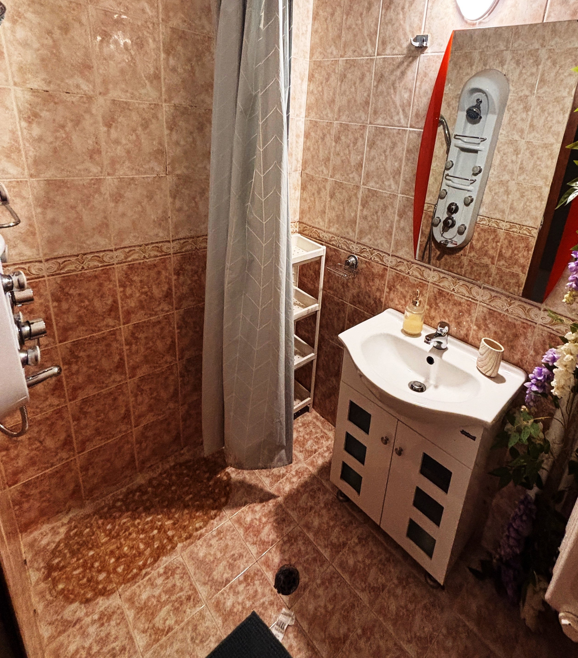 Bathroom with sink and shower curtain