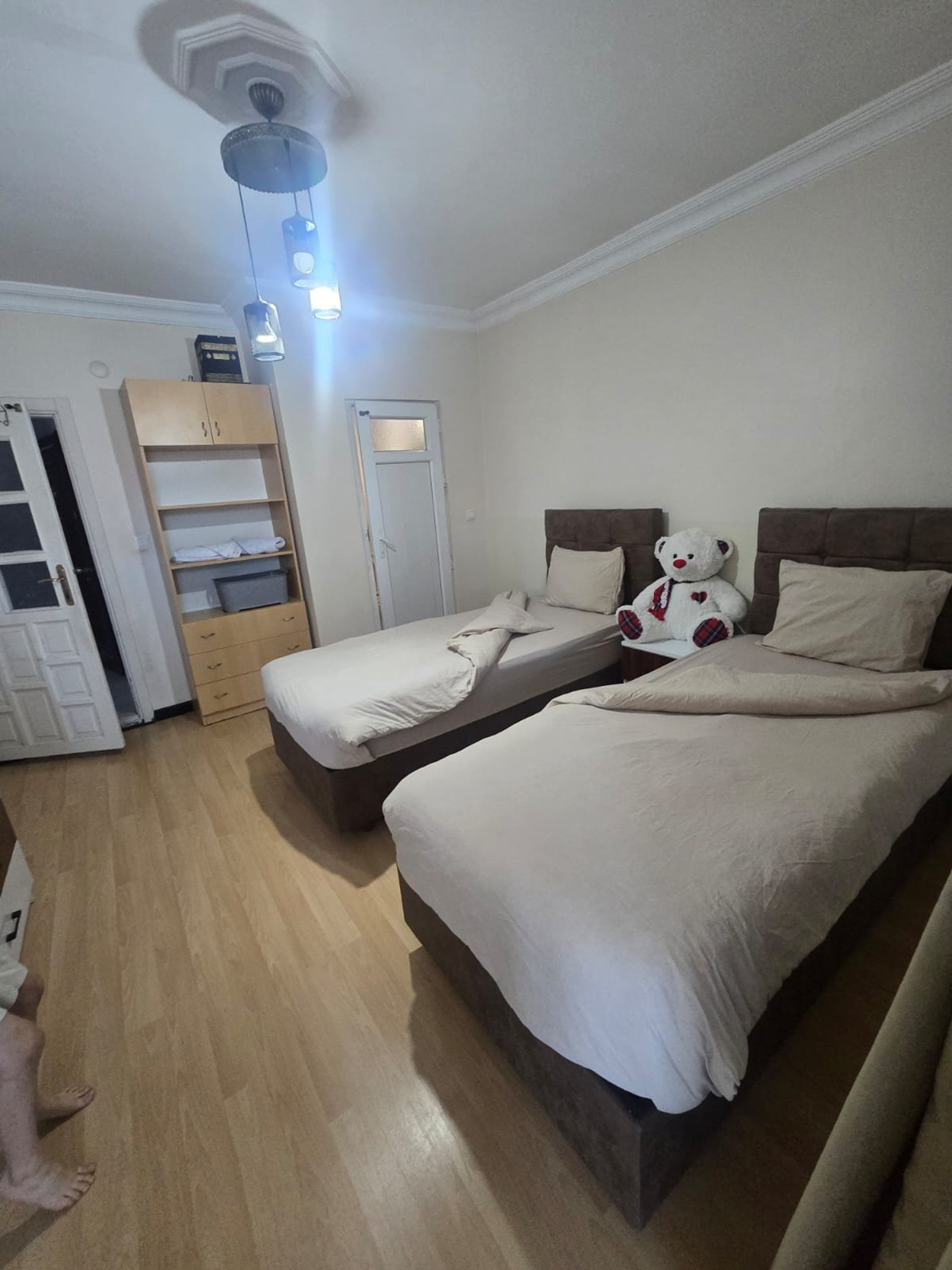 Bedroom with twin beds and wardrobe
