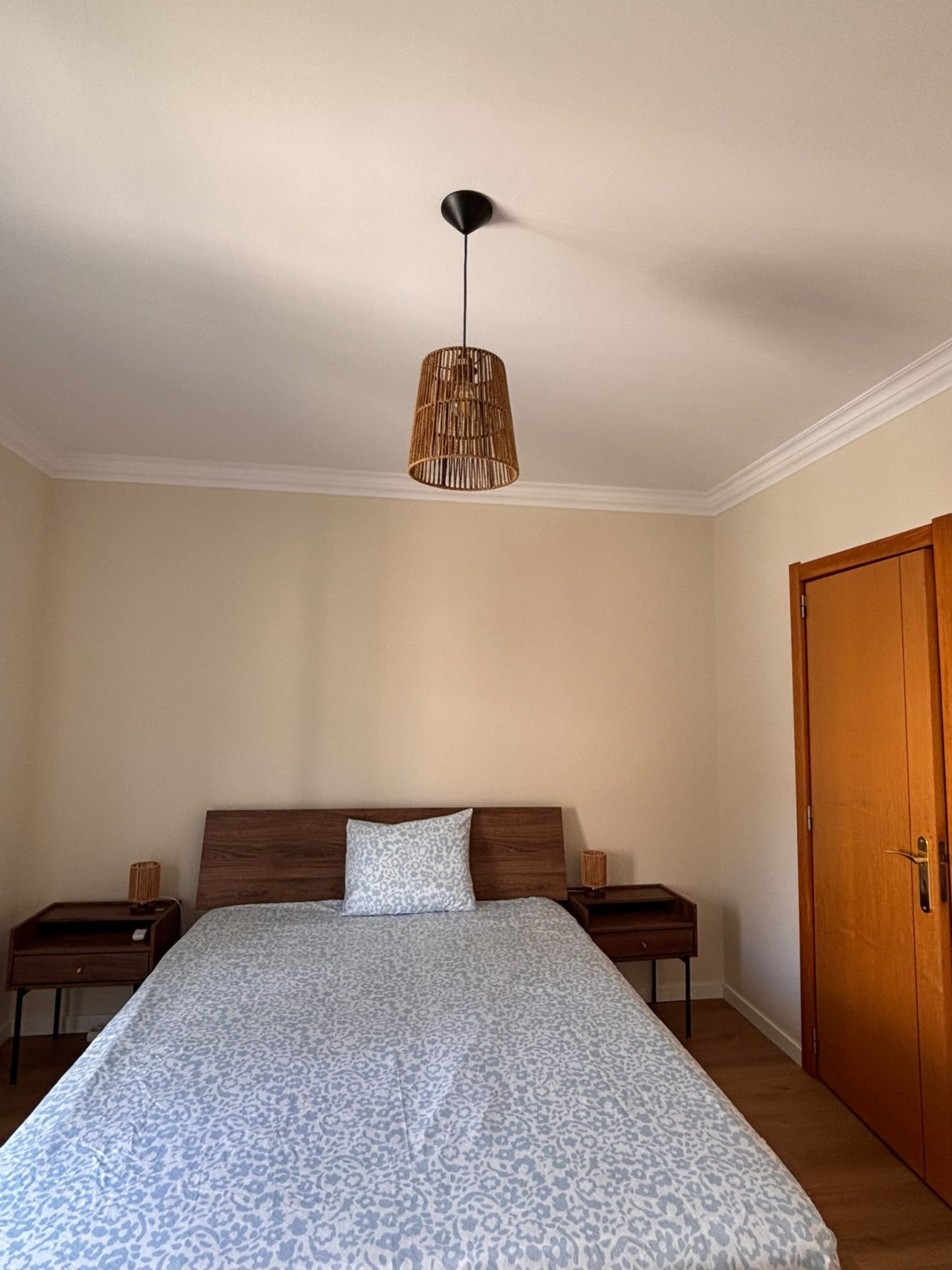 Cozy bedroom with wooden bed