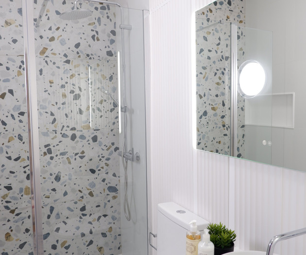 Bathroom with vanity and mirror