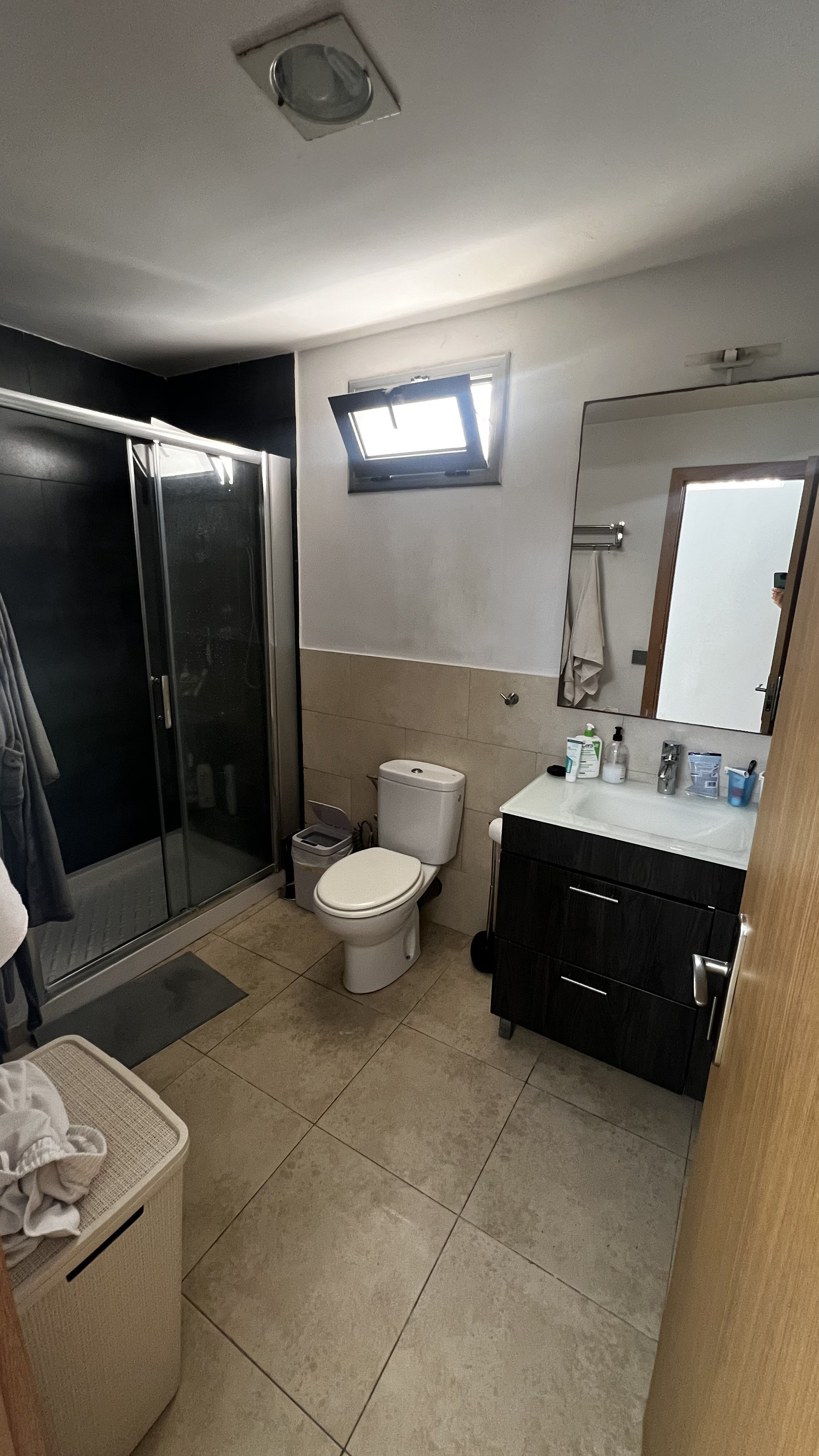Bathroom with shower and vanity
