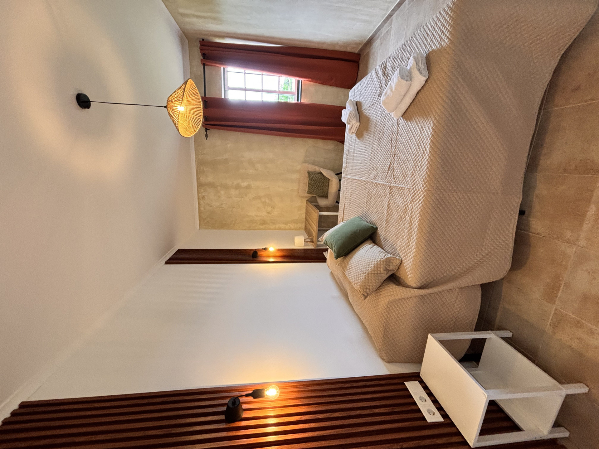 Bedroom seating area with lamp