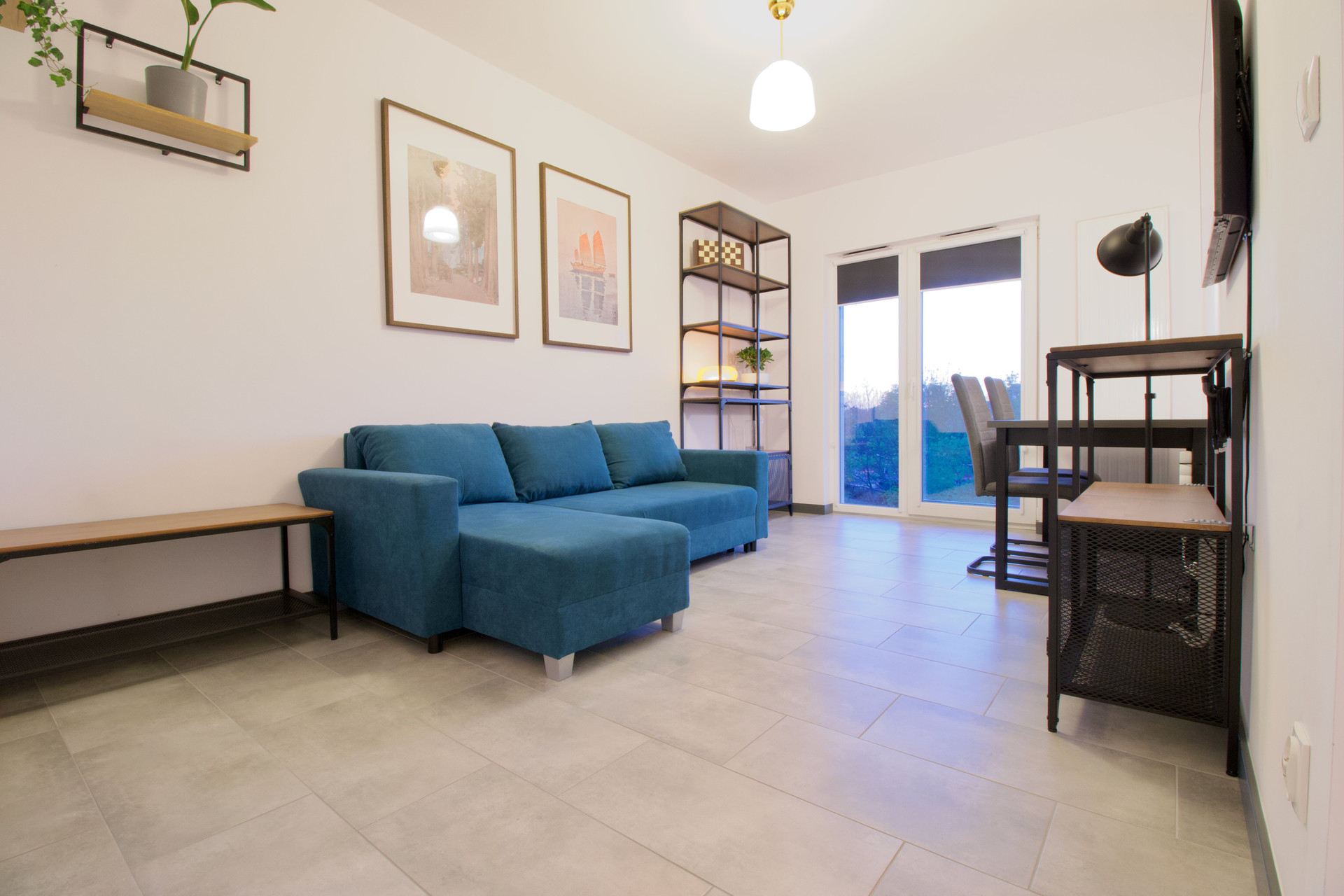 Bright living room with blue sofa