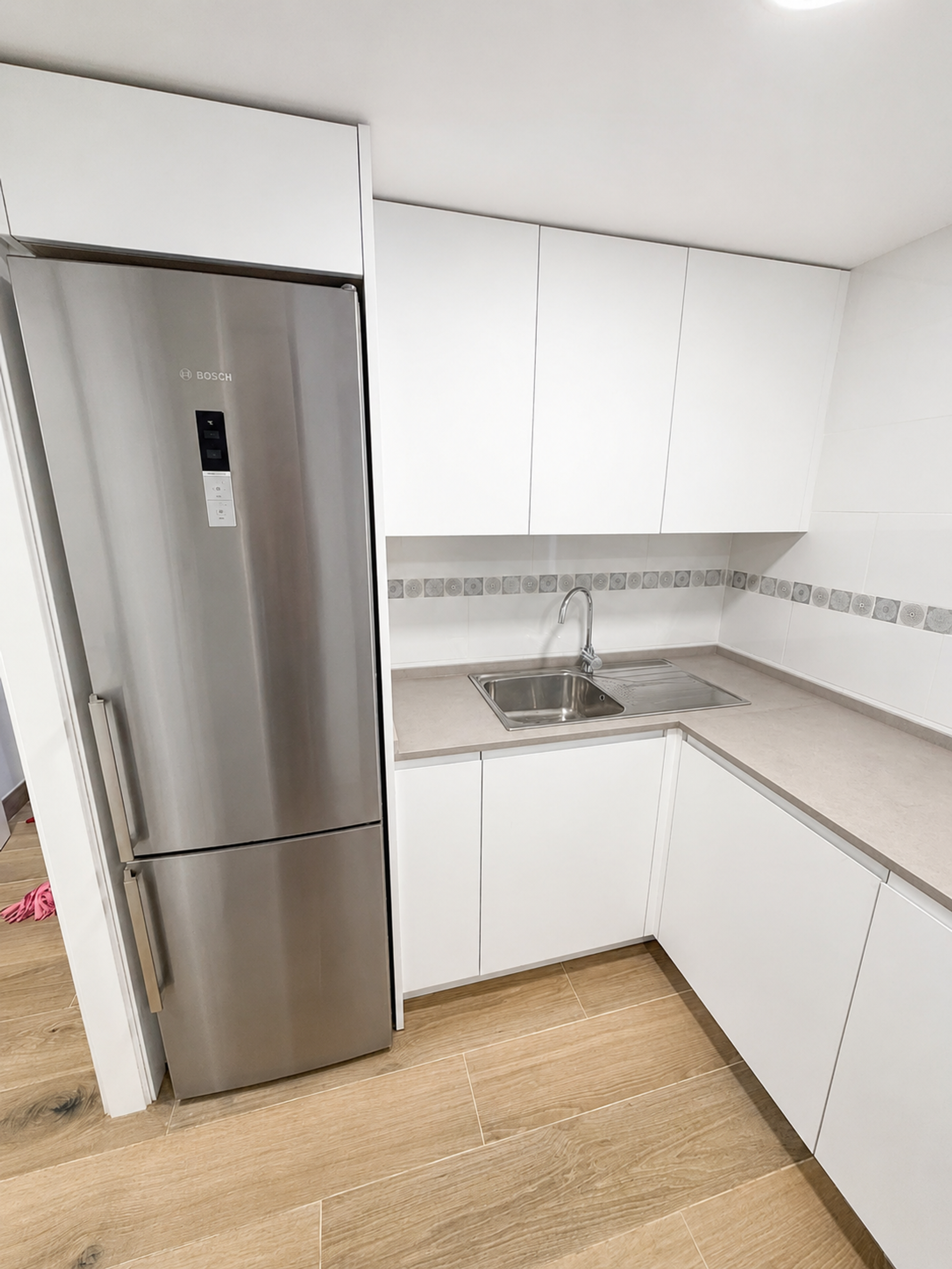 Kitchen with fridge and sink