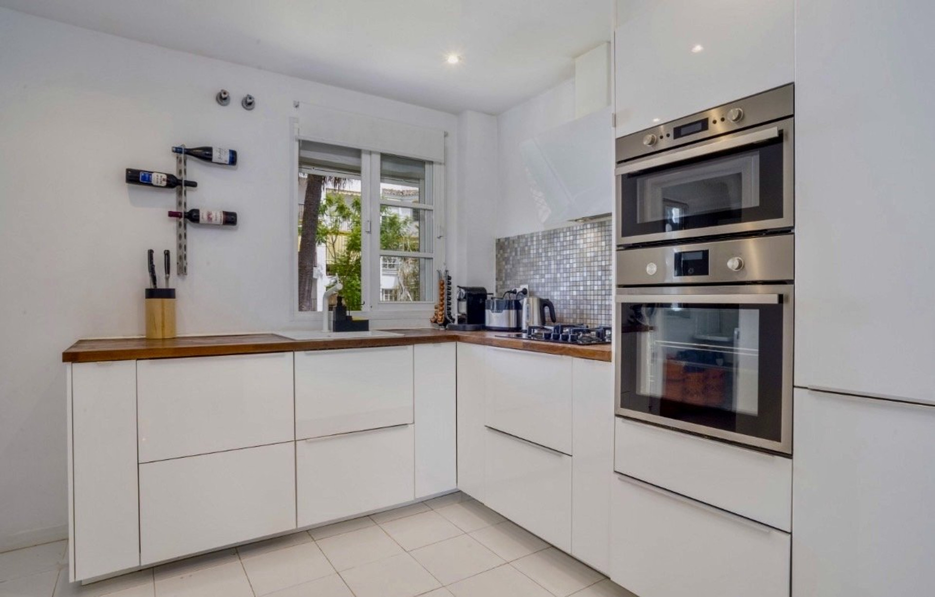 Modern white kitchen with appliances