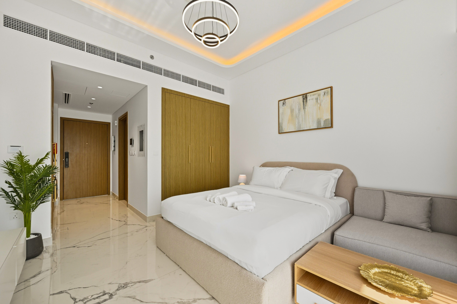 Bedroom with sofa and hallway