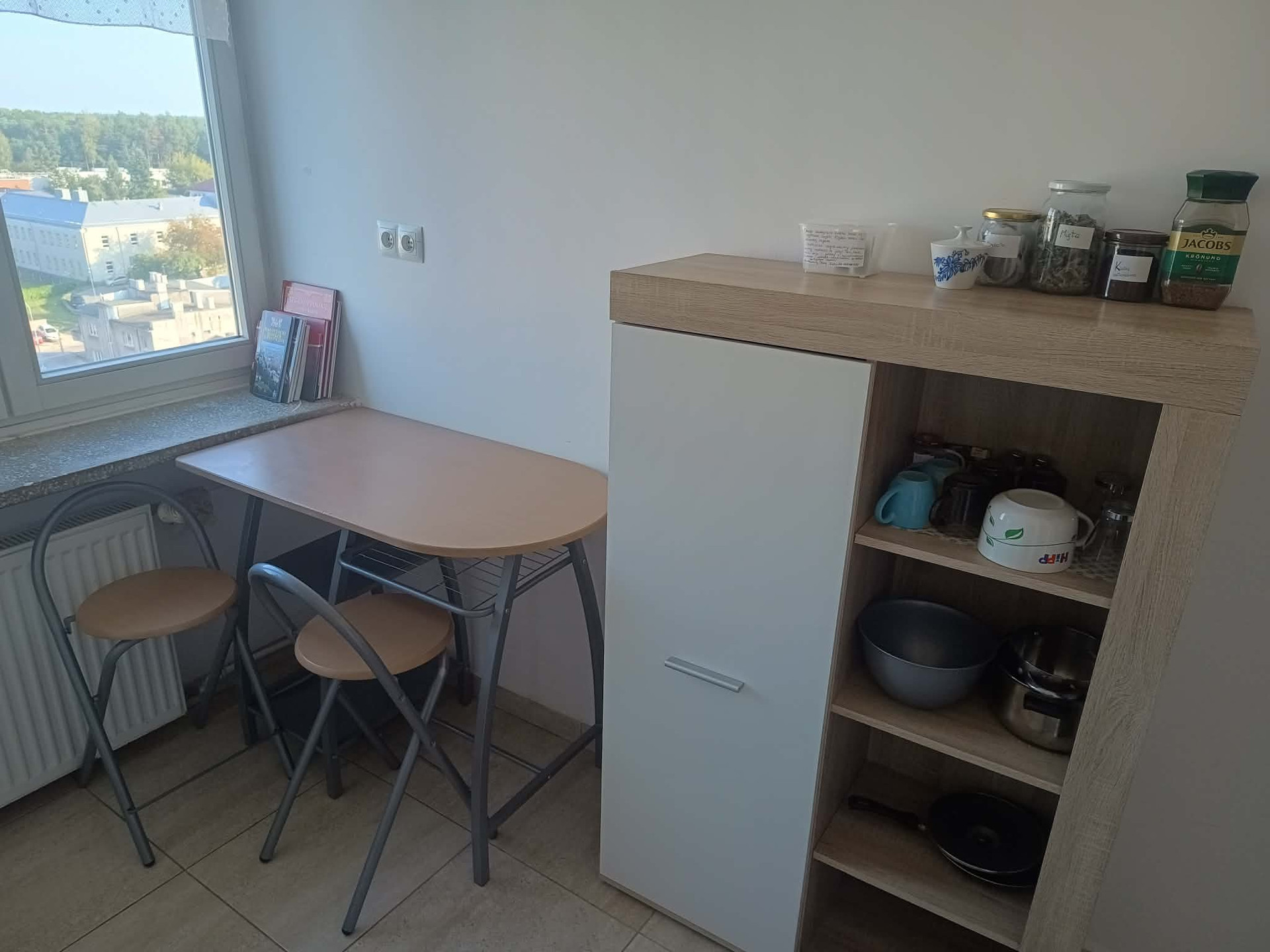 Kitchen dining nook with storage shelf