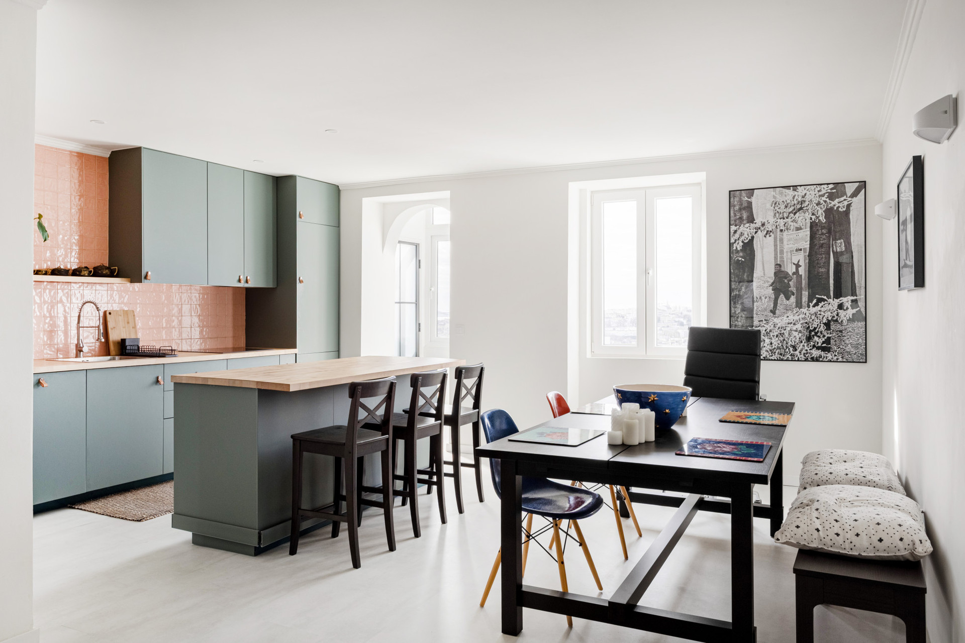 Open- plan living room and kitchen with a two-seater sofa, dining table for 6 and AC
