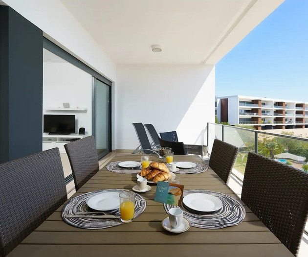 Balcony dining table with breakfast setup