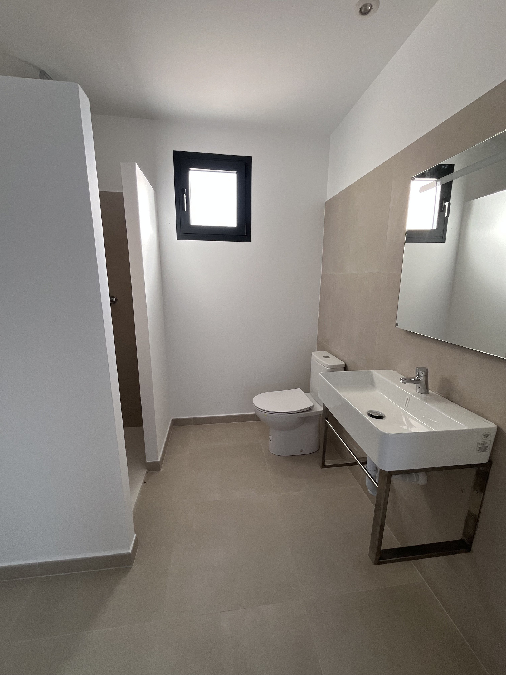 Modern bathroom with large sink mirror