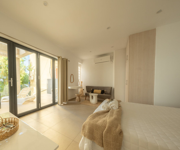 Bedroom with seating and terrace