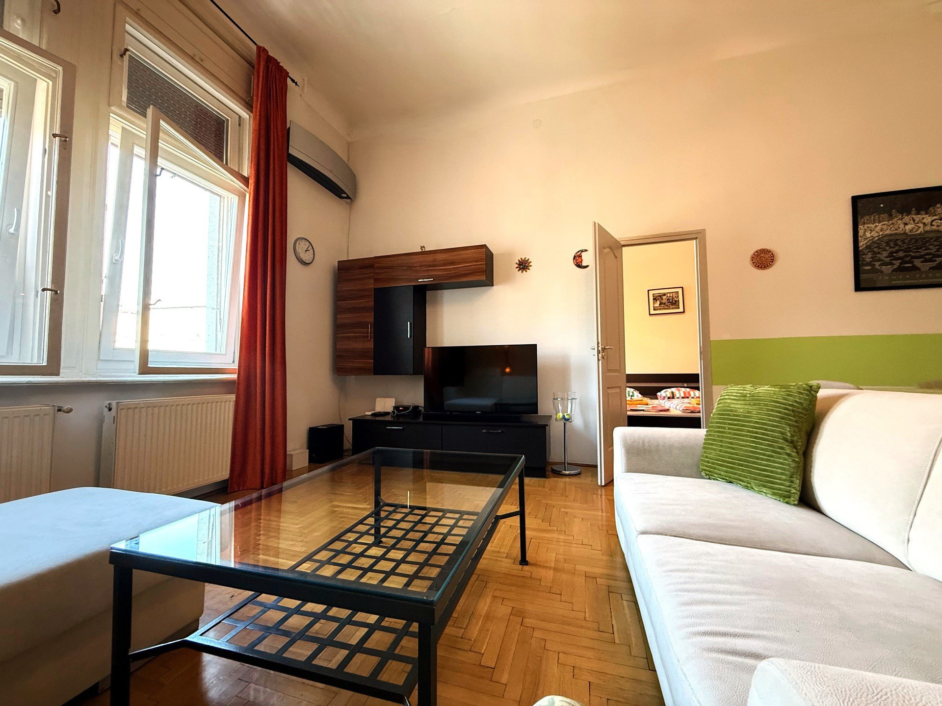 Living room with TV and windows