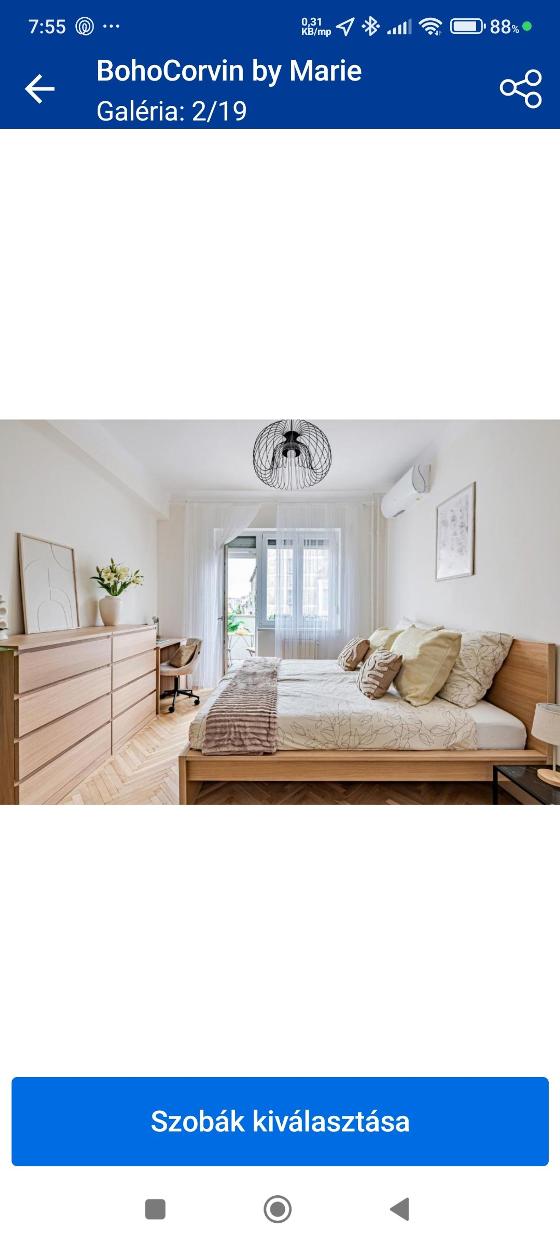 Bright bedroom with dresser and balcony