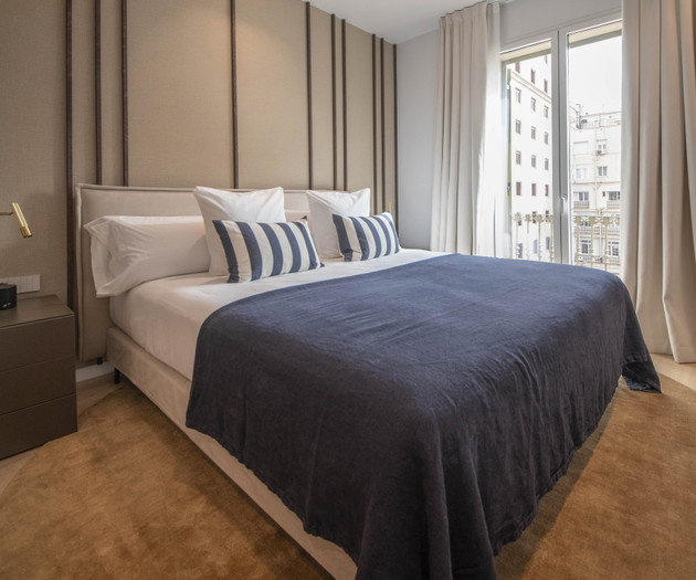 Bedroom with navy blanket