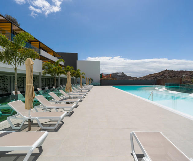 Rooftop pool with loungers