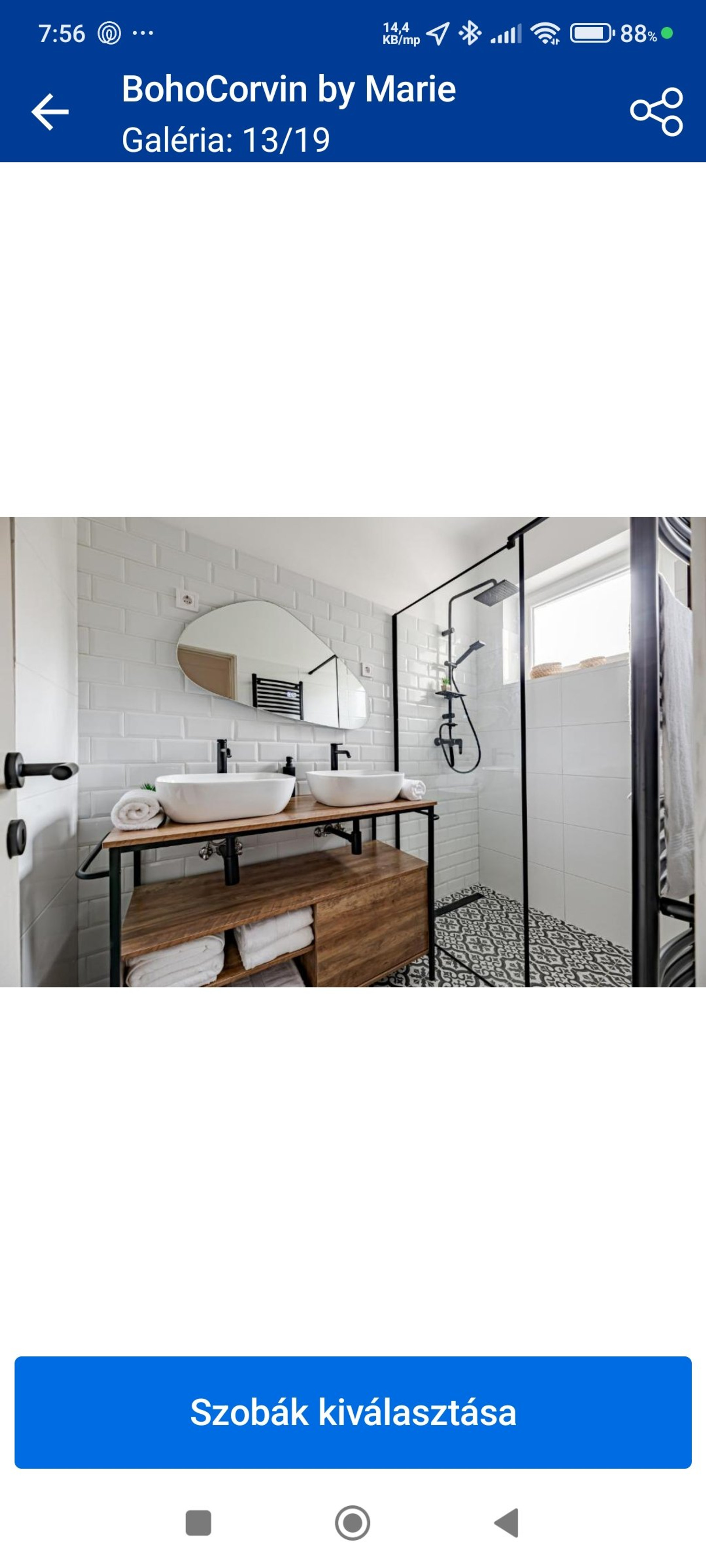 Bathroom with dual sinks and shower