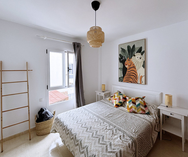 Bright bedroom with double bed