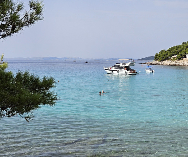 Boats anchored in clear bay