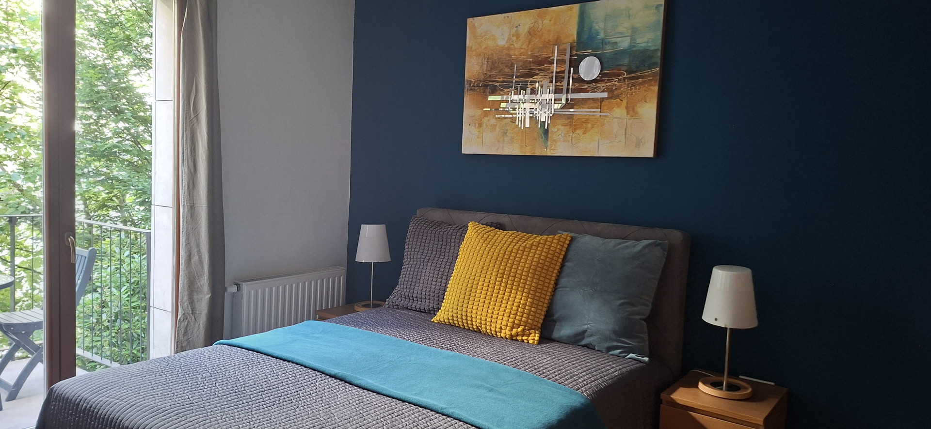 Bedroom with blue accent wall
