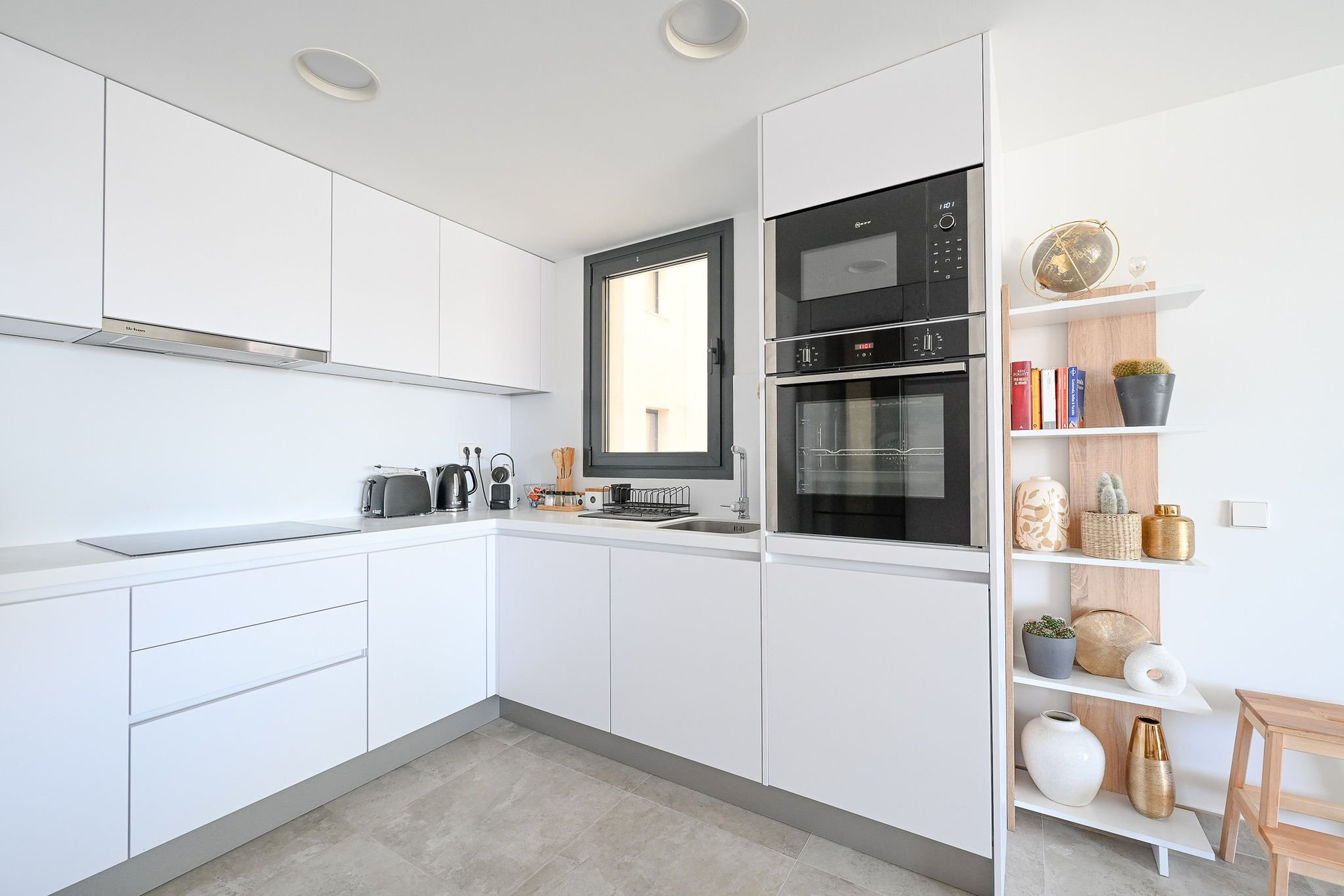 Modern white kitchen with oven