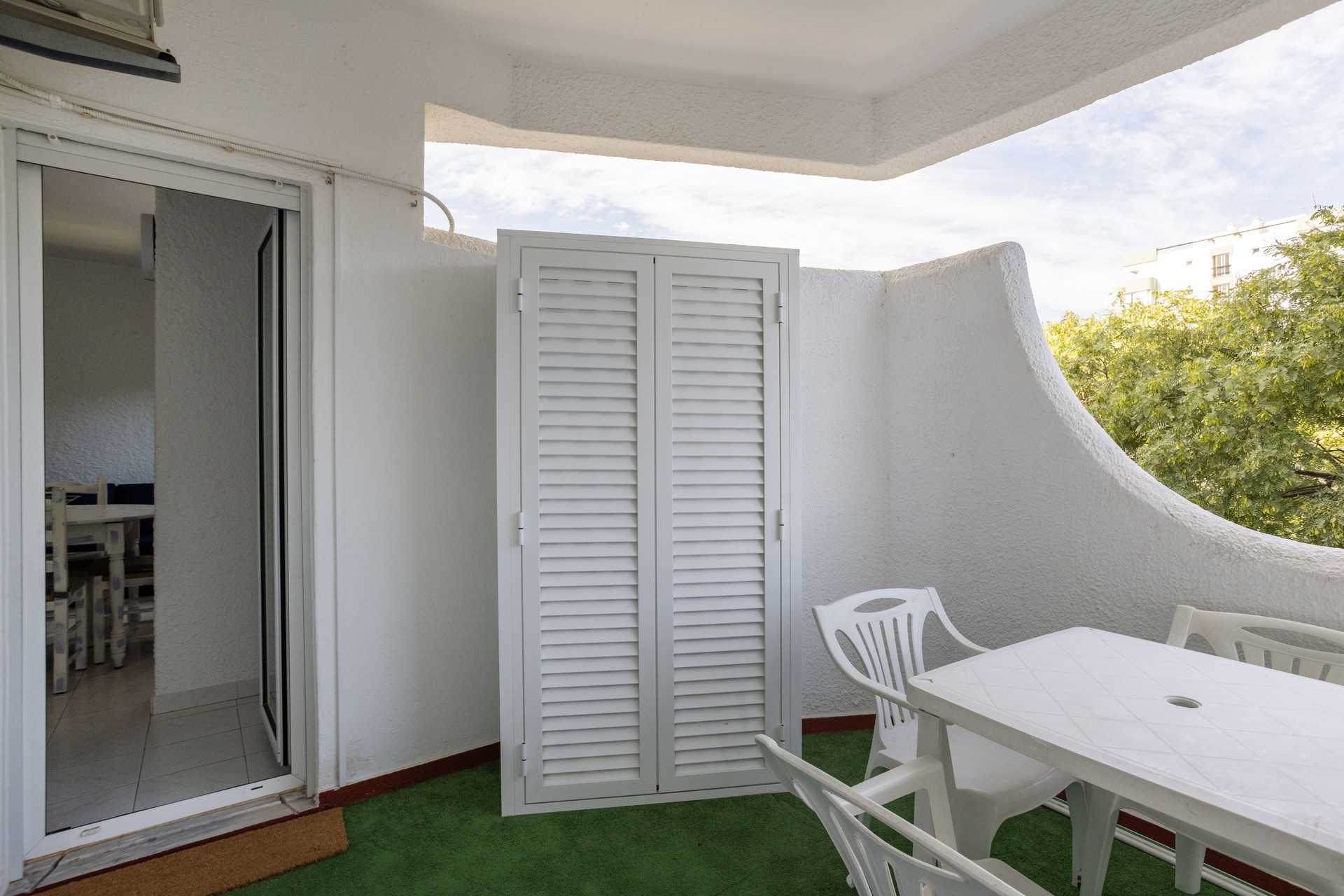 Balcony with storage and garden view