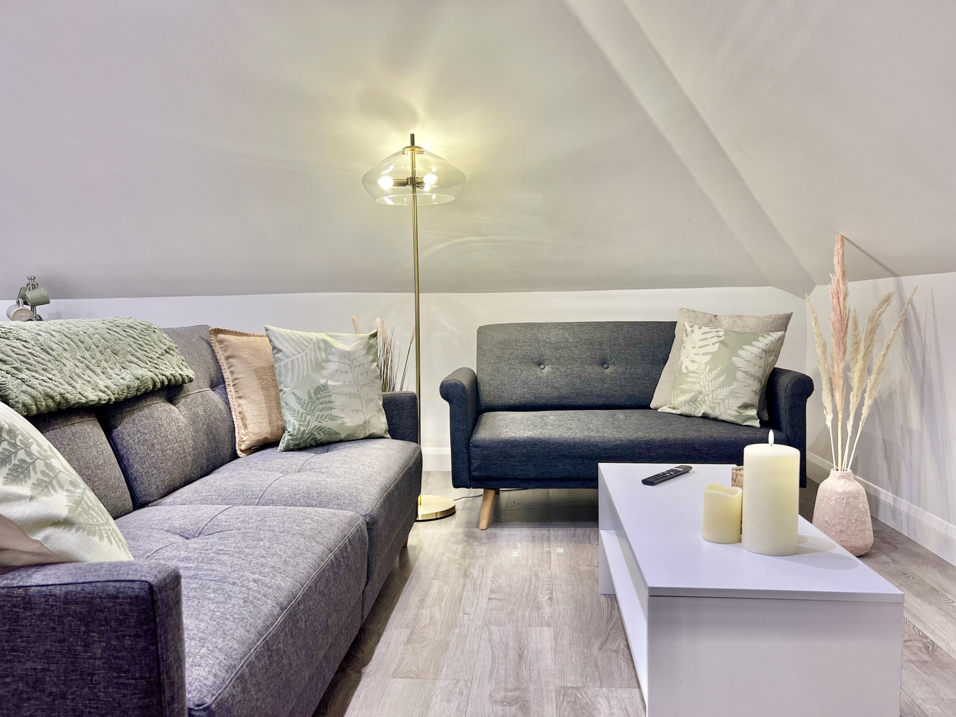 Living Room: Stylish seating and soft lighting create a perfect spot to unwind and relax!
