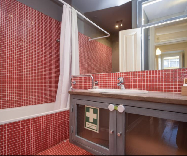 Red mosaic tiled bathroom