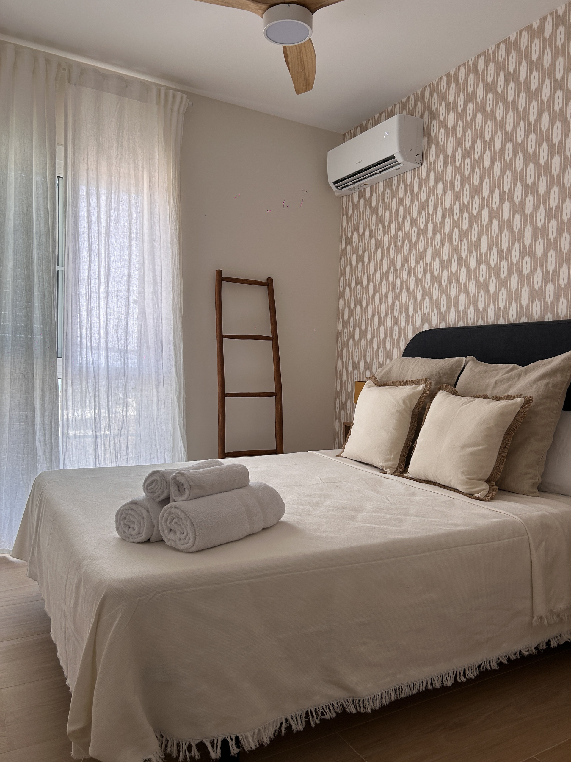 Bedroom with bed and towels