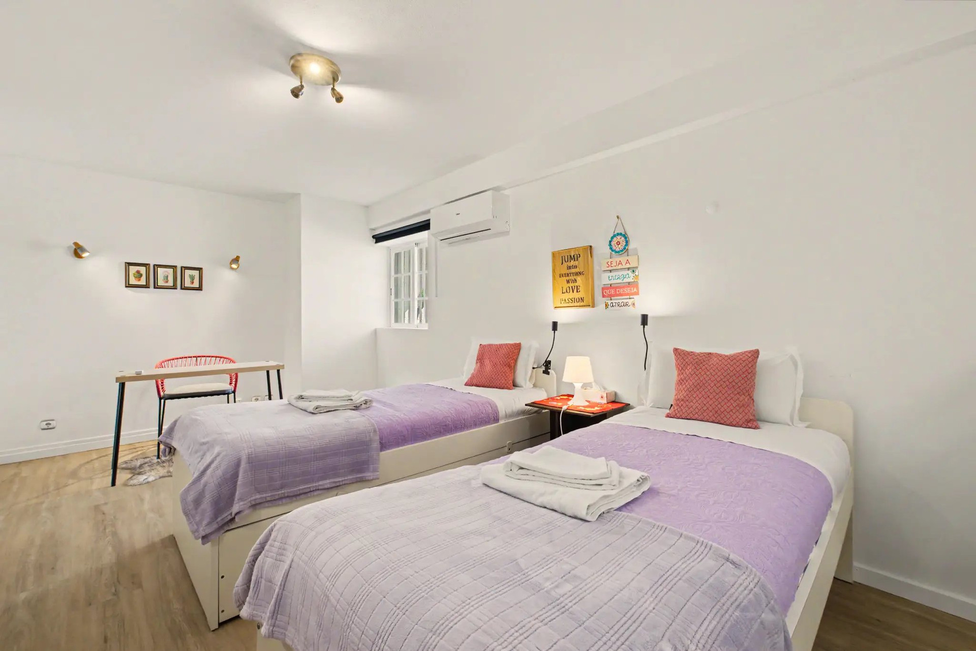 Twin bedroom with purple bedding