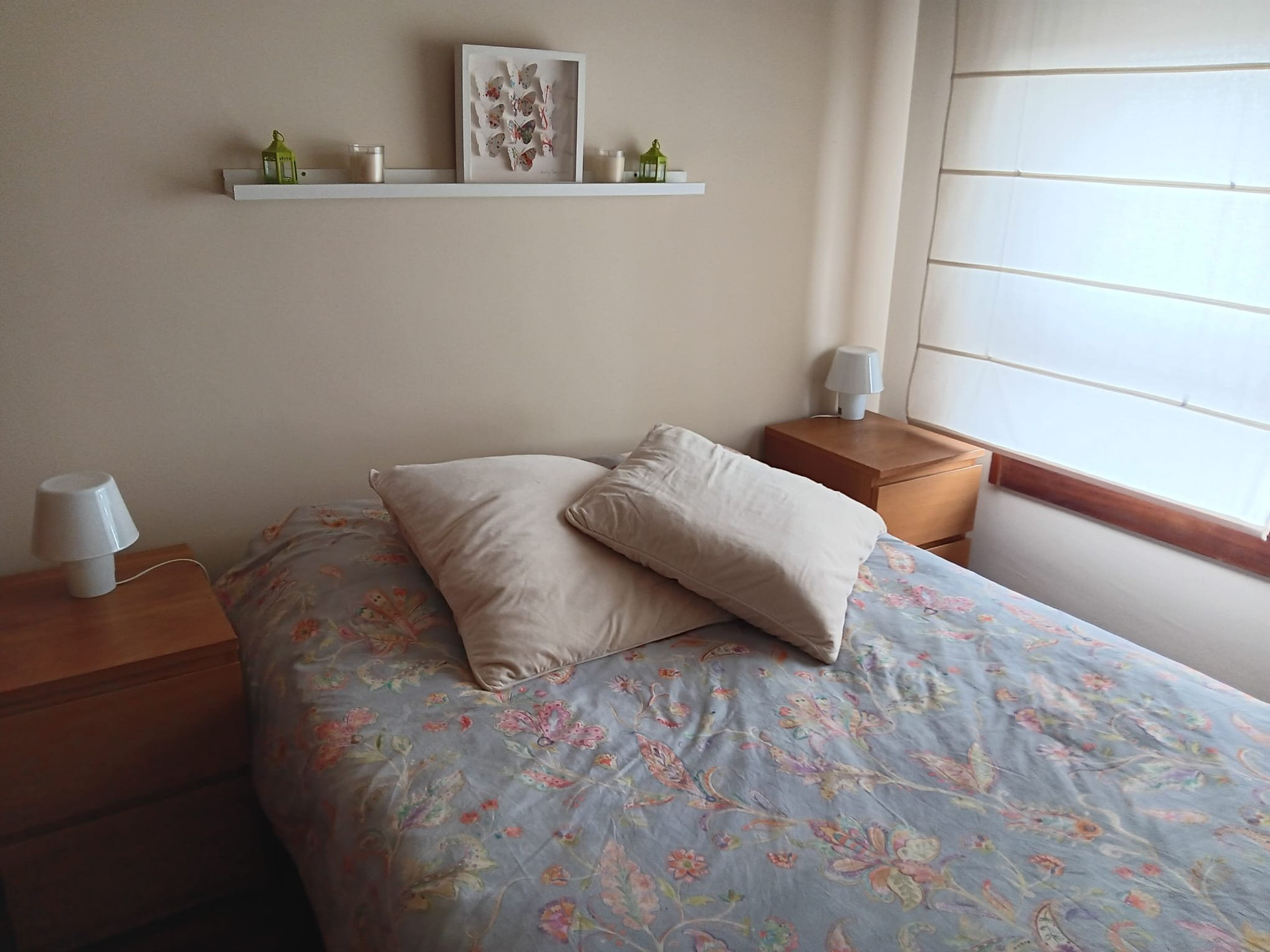 Bedroom with floral bedding closeup
