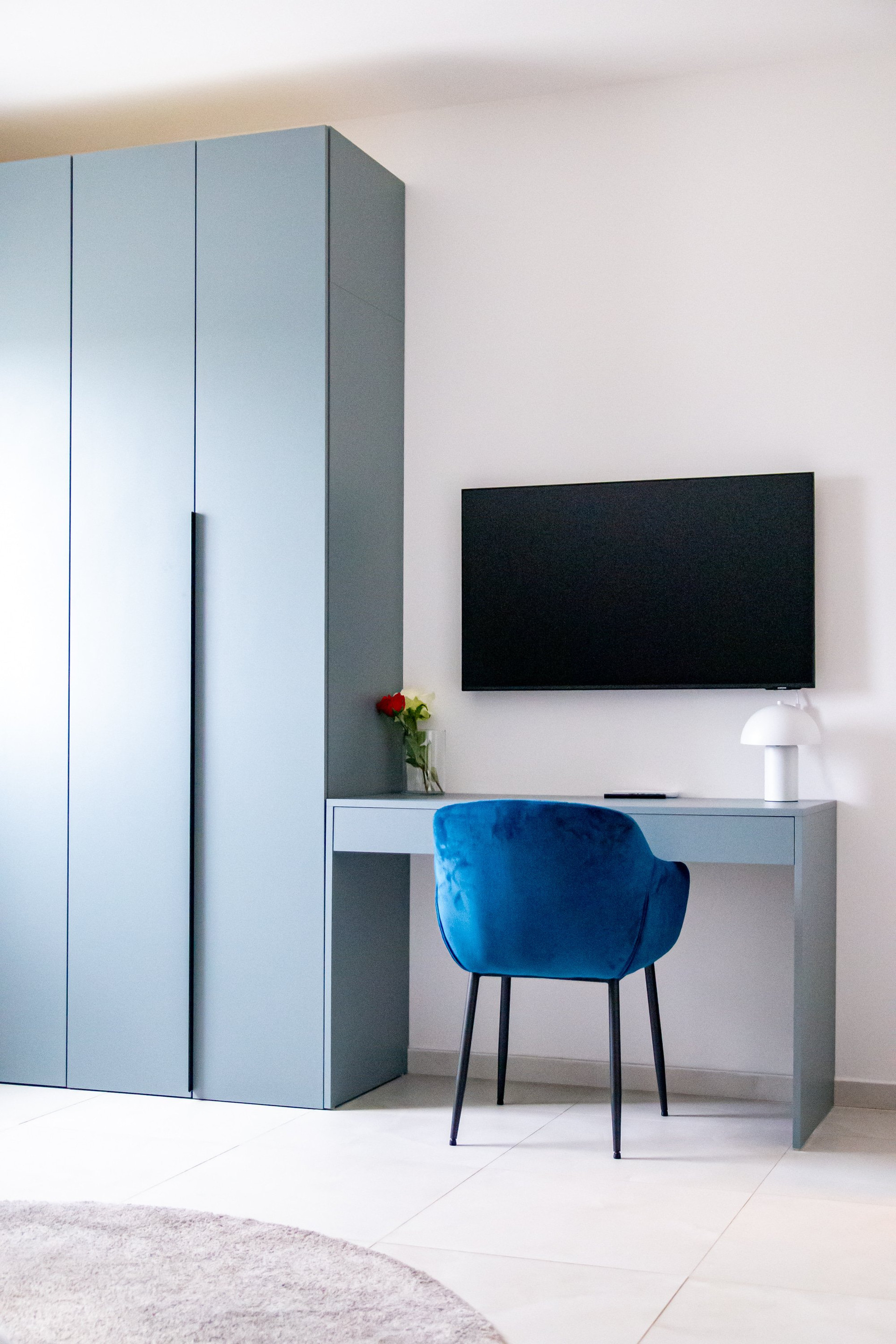 Bedroom desk with TV and wardrobe