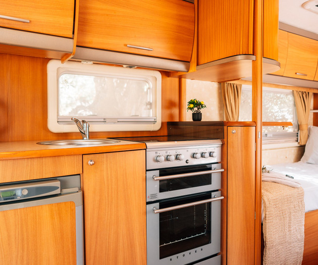 Kitchenette with stove and sink