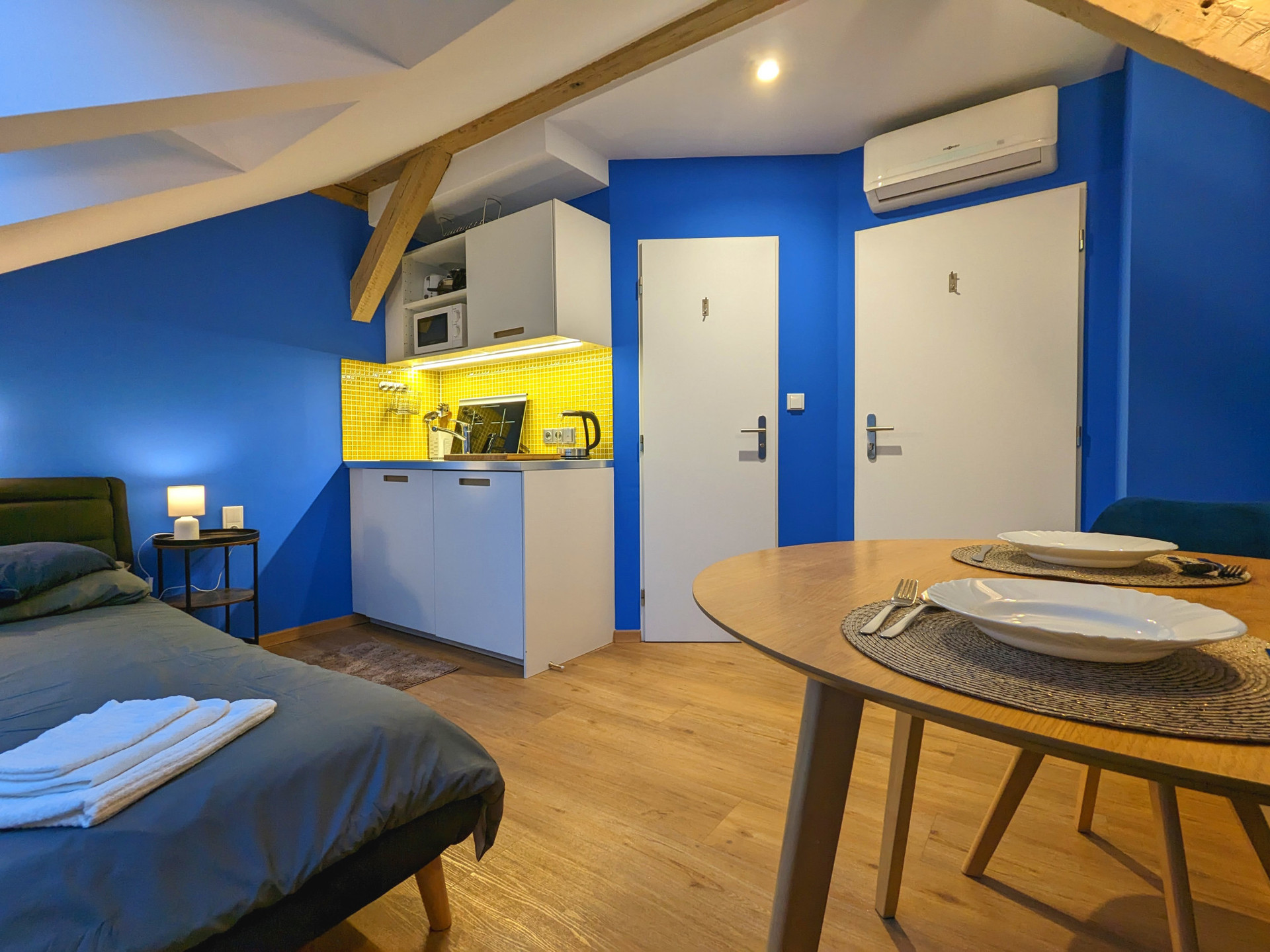Full interior shot, with bathroom and entrance door shown.