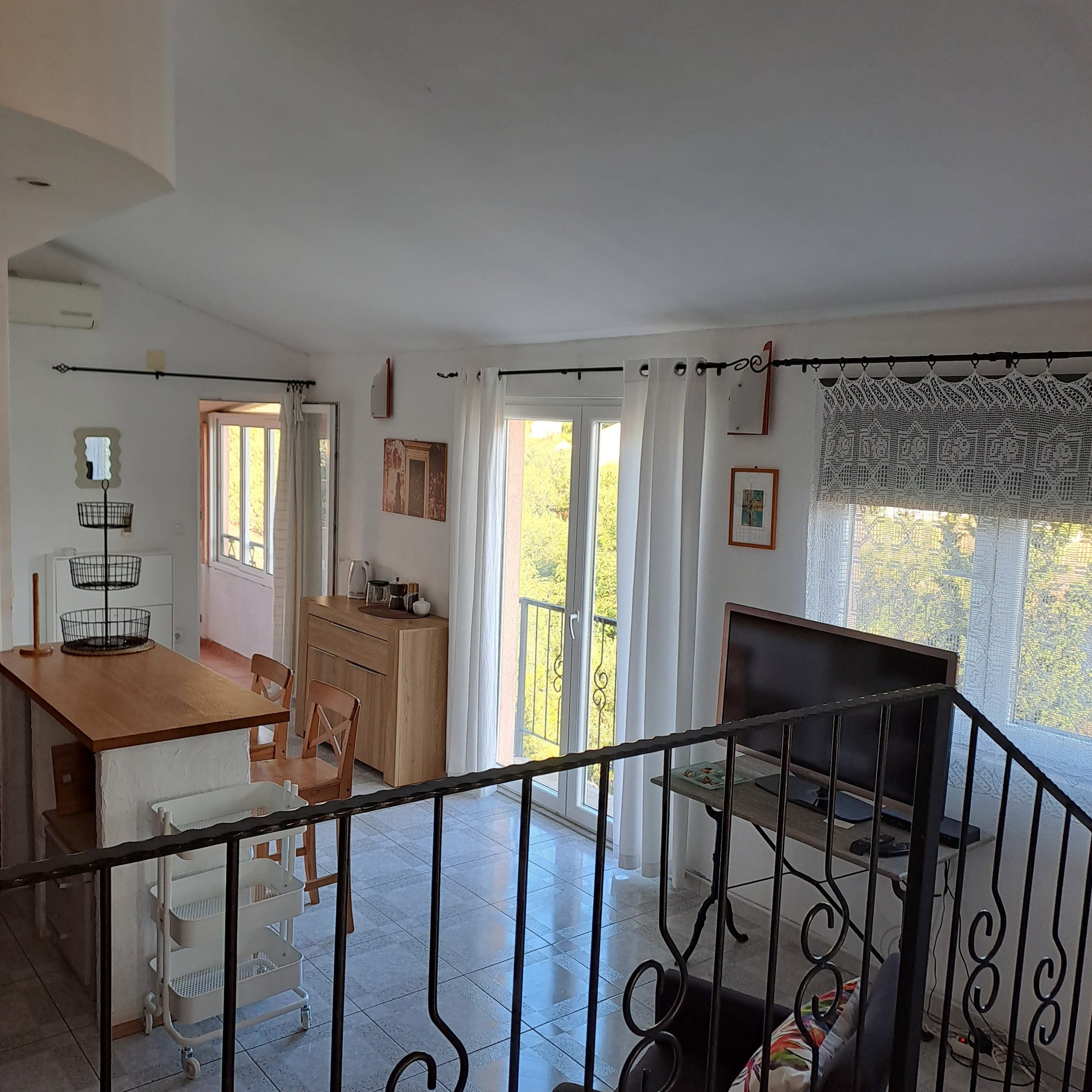 Living area with TV and balcony
