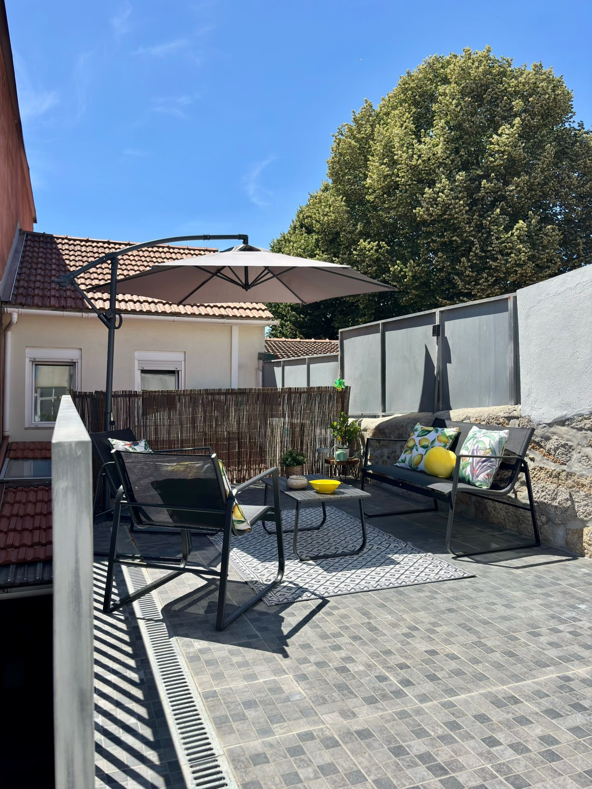 Sunny outdoor patio with seating