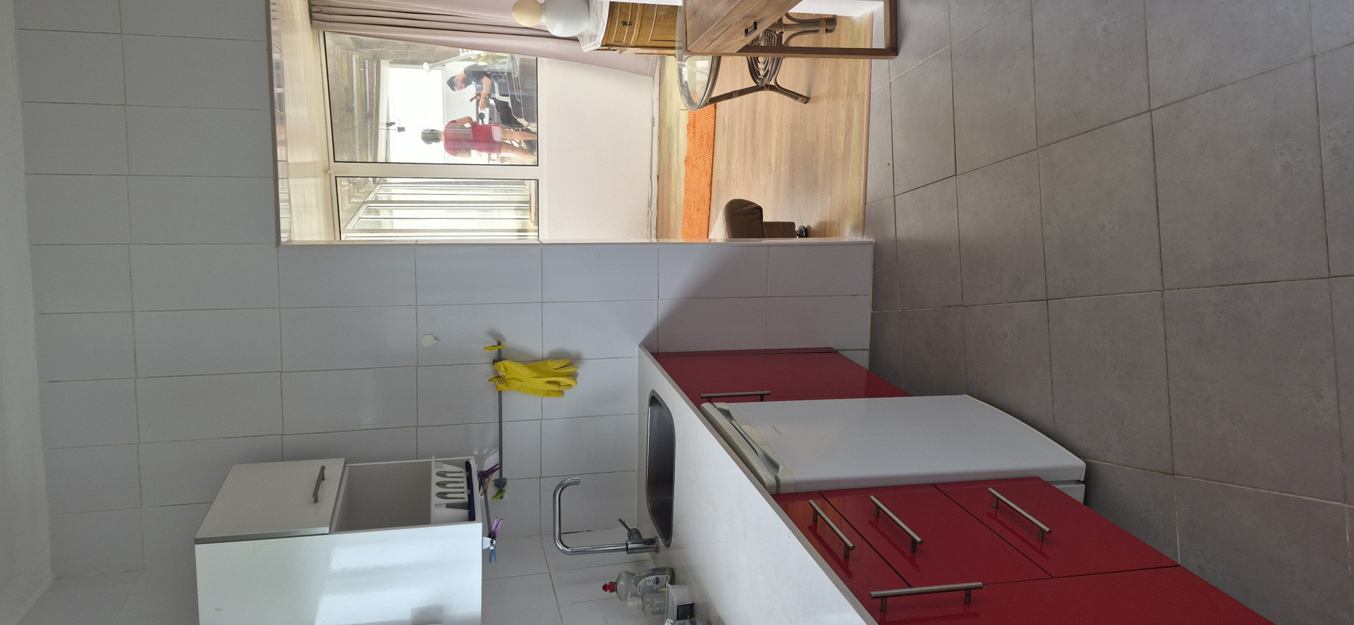Red kitchen with tiled walls