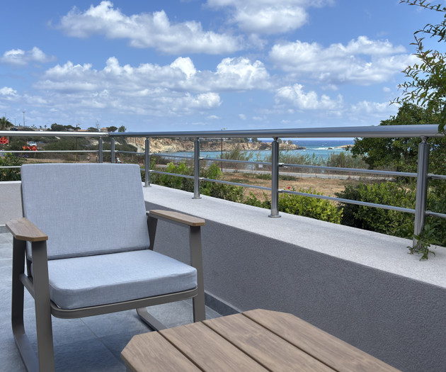 Balcony chair facing the sea