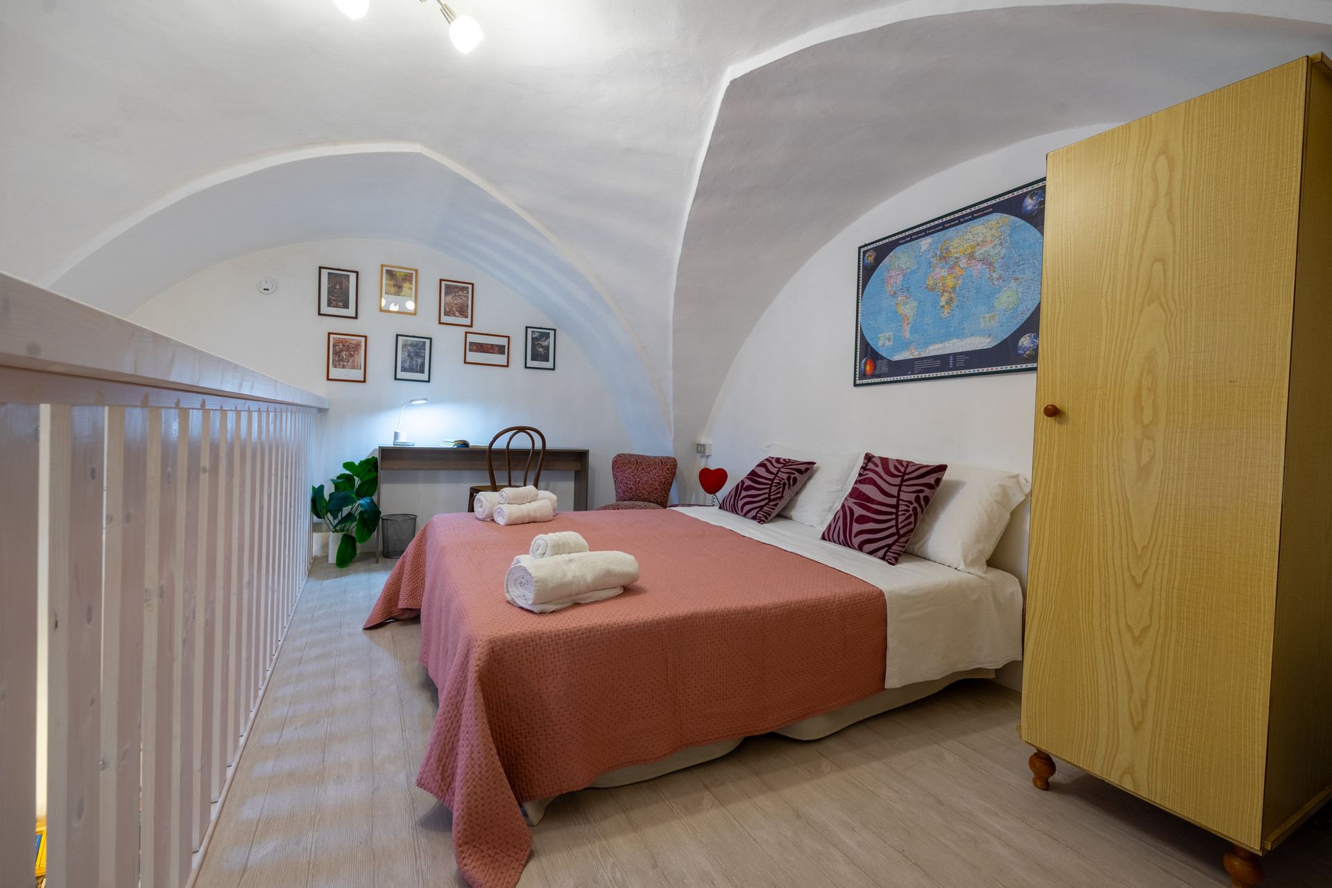 Loft bedroom with vaulted ceiling