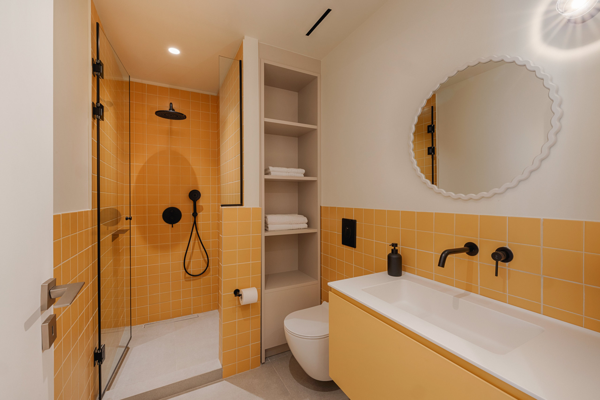 Yellow tiled bathroom with shower