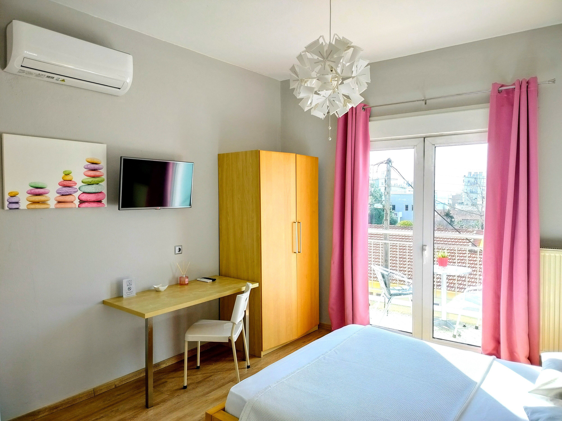 Bedroom with desk and TV