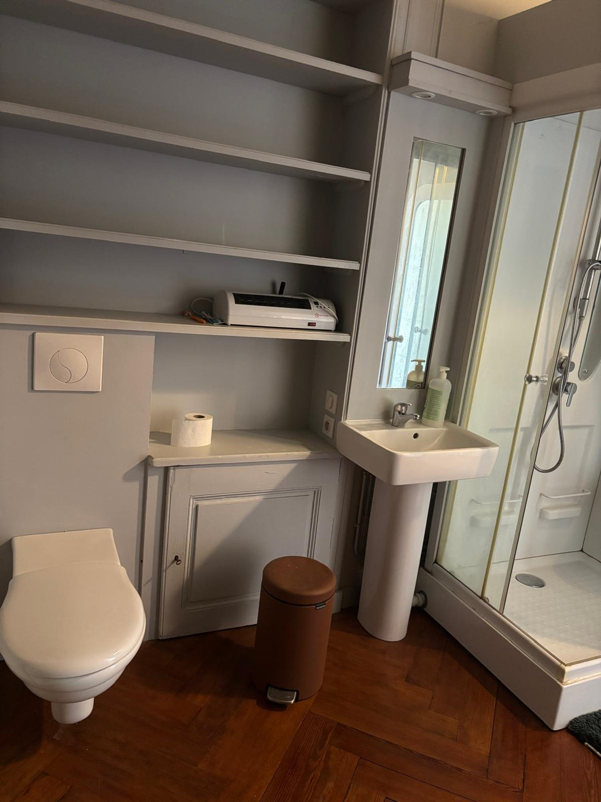 Bathroom with sink and shower stall