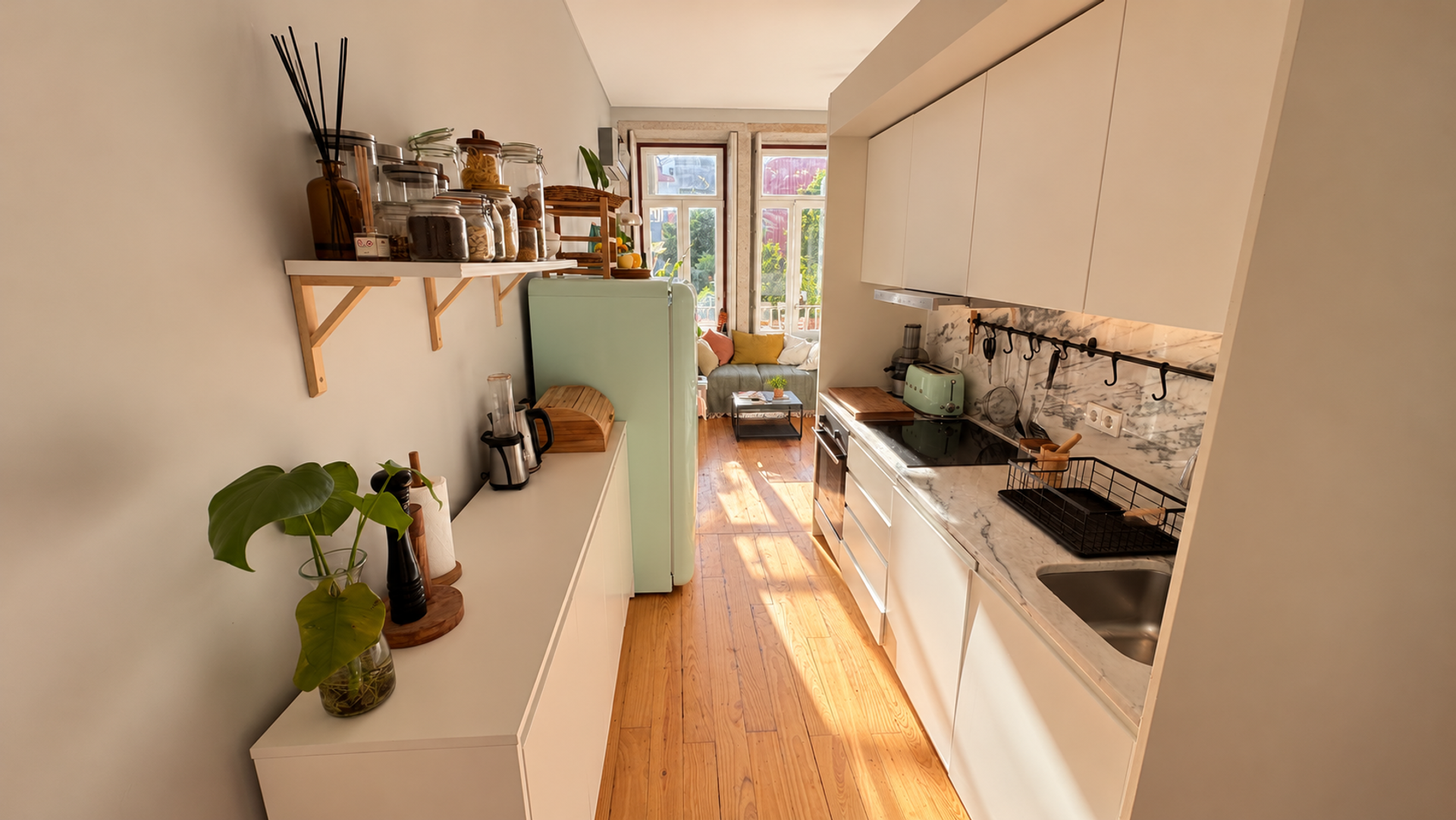 Galley kitchen toward sunny living room