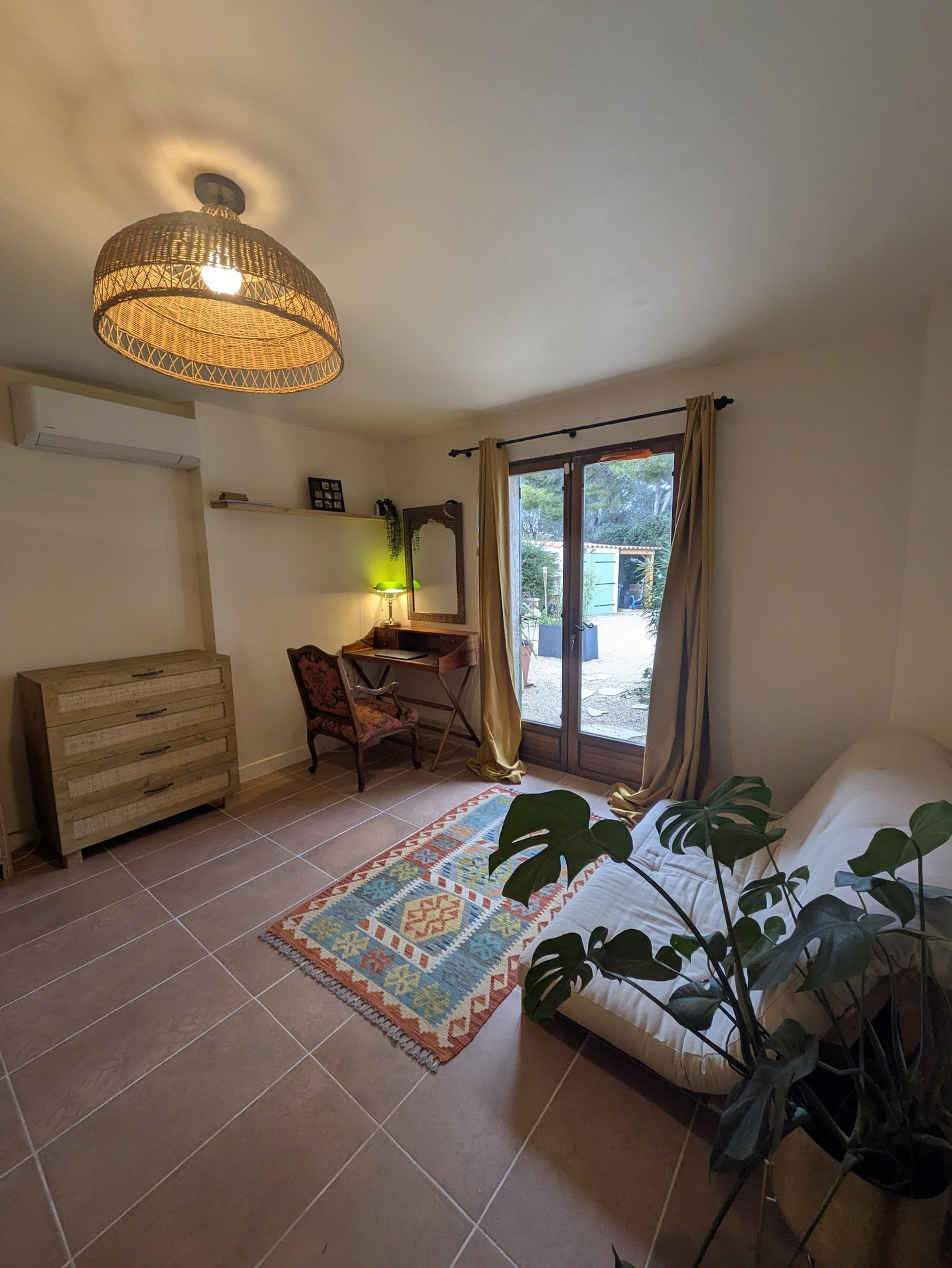Bedroom with desk and garden door