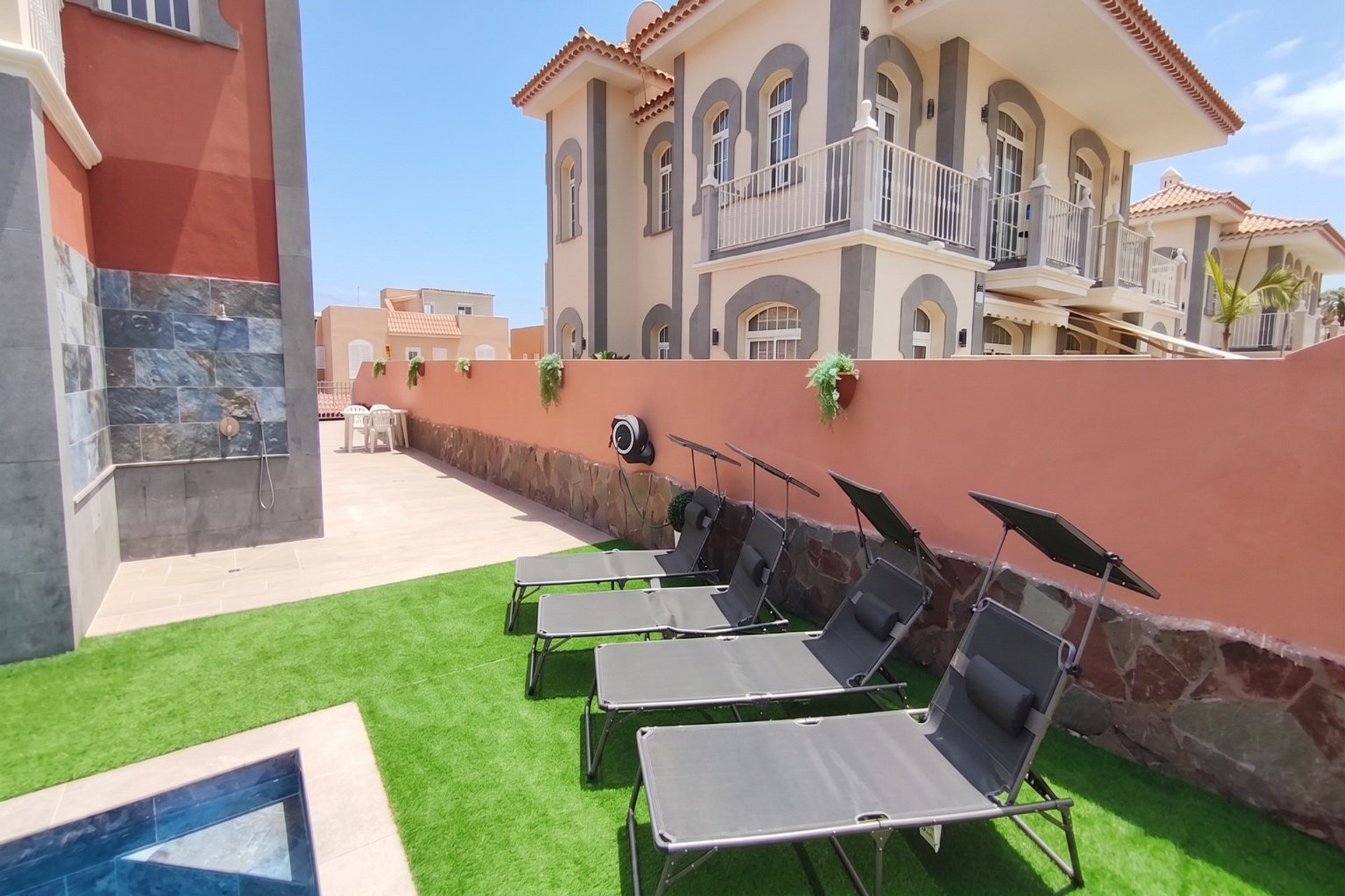 Loungers, pool and outdoor shower