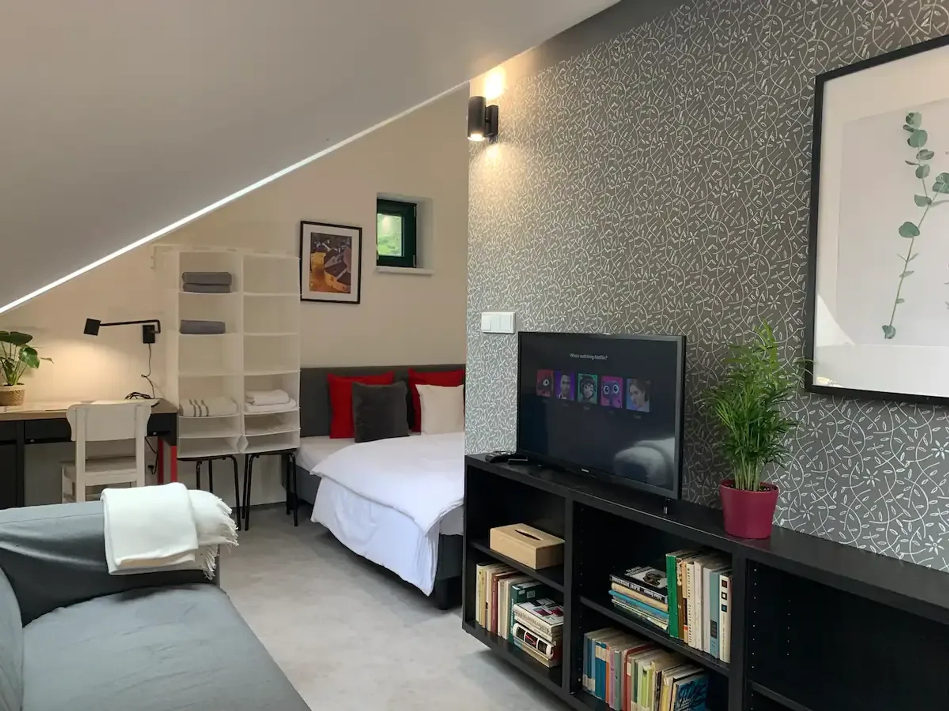Attic studio with bed and TV