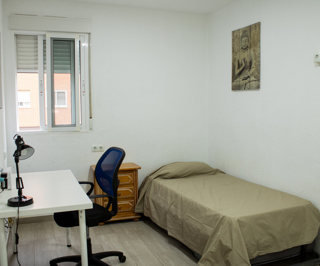 Bedroom with desk and single bed