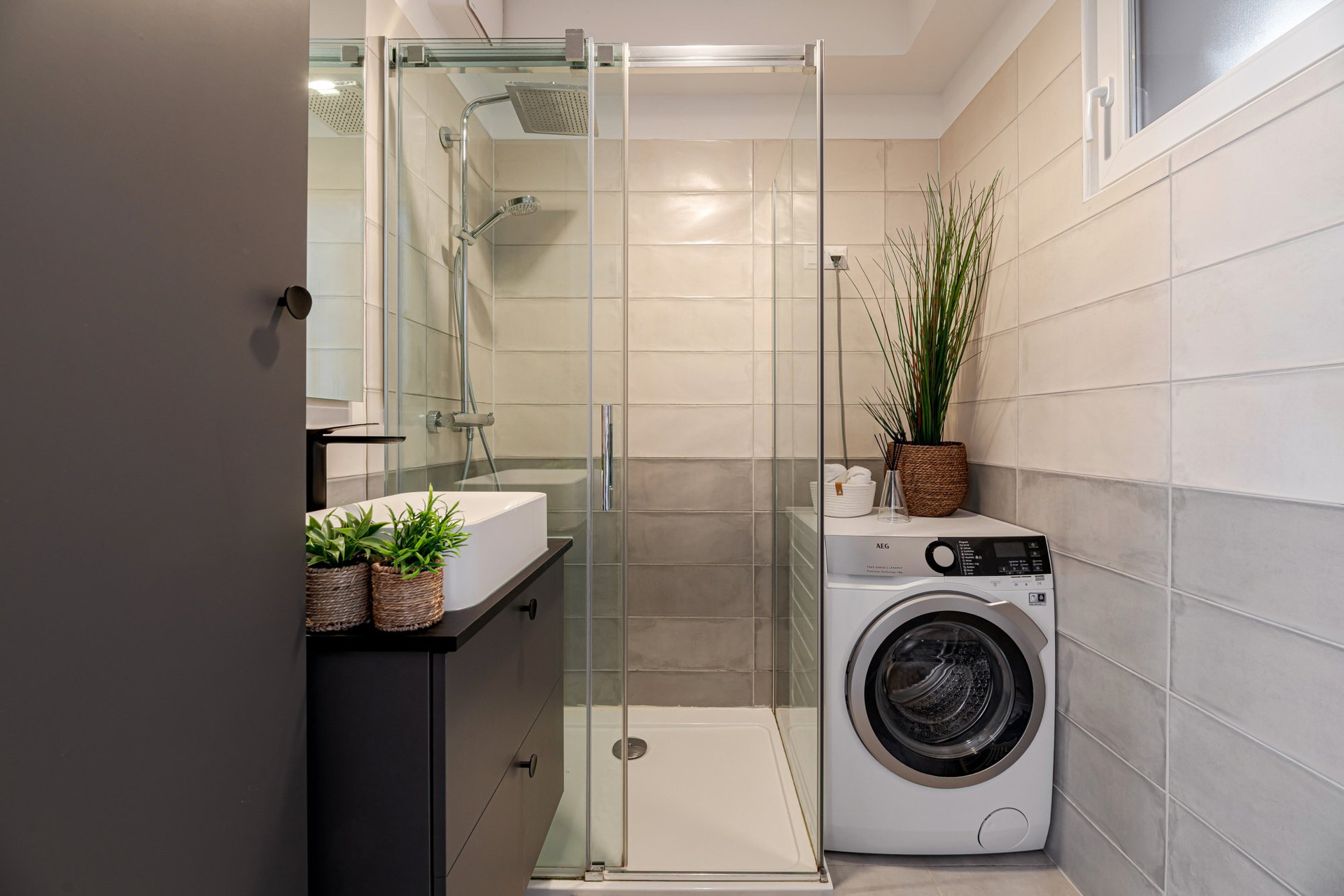 Bathroom with shower and washer