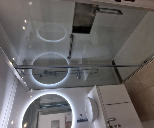 Bathroom ceiling with round mirrors